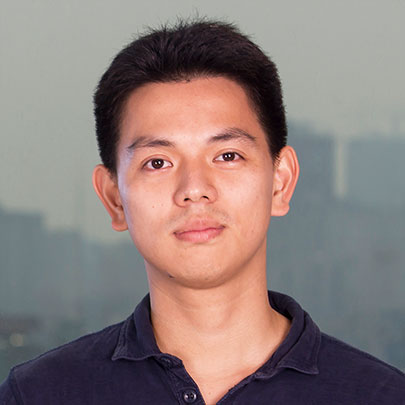 Young Asian man with short black hair wearing a dark blue shirt