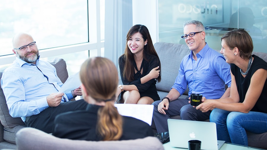 Team collaboration and discussion in a bright modern office setting
