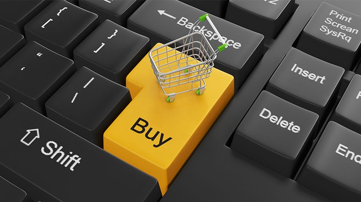 Buy button key with shopping cart on black computer keyboard for Commerce
