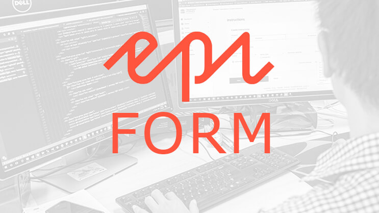 Developer working on Optimizely Forms configuration on dual monitors