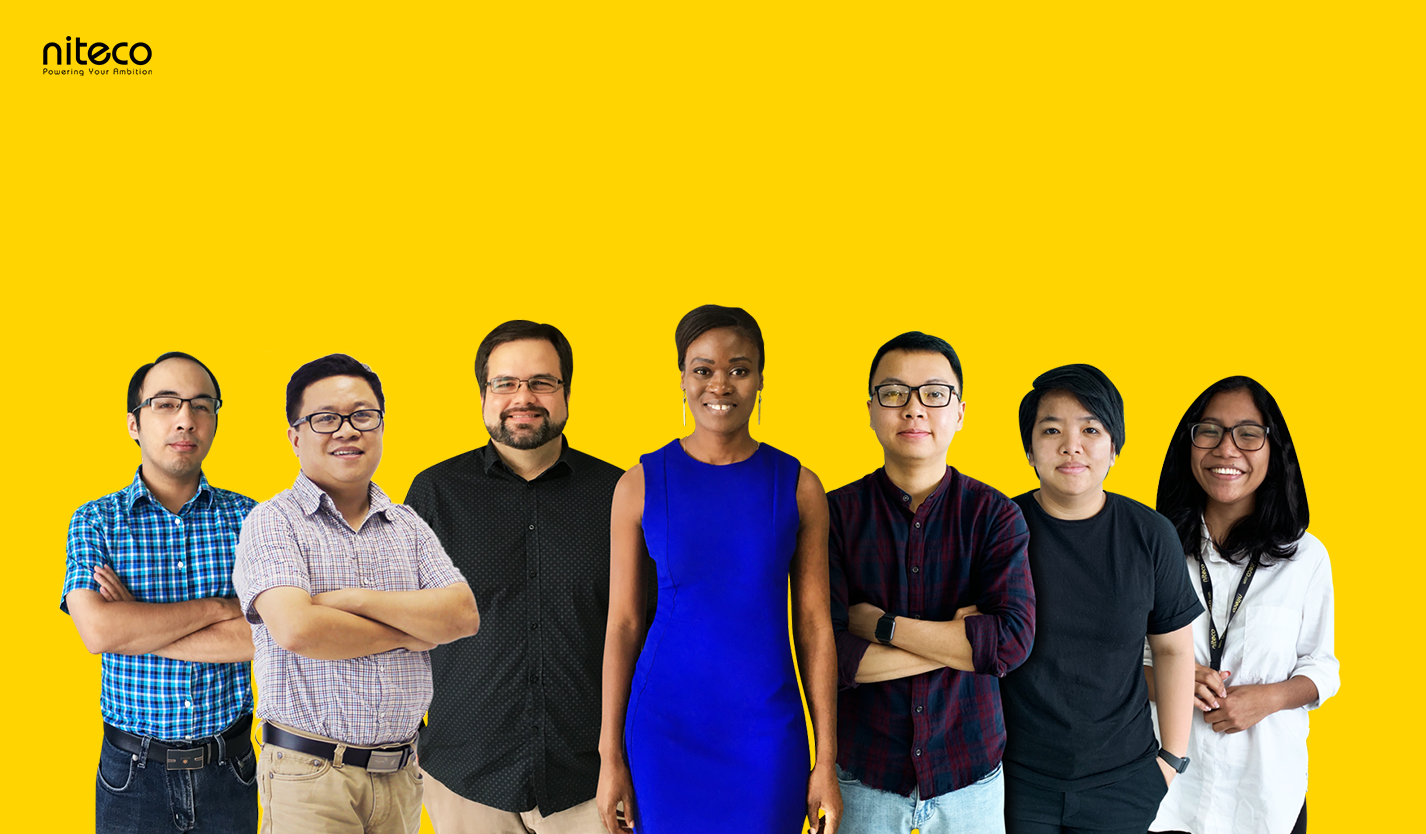 Niteco diverse tech team standing confidently against yellow background