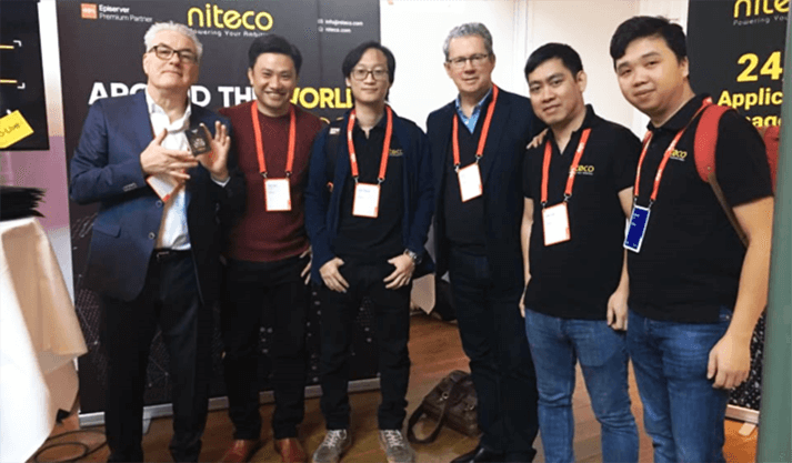 Niteco team members at a tech event showcasing application solutions and partnerships