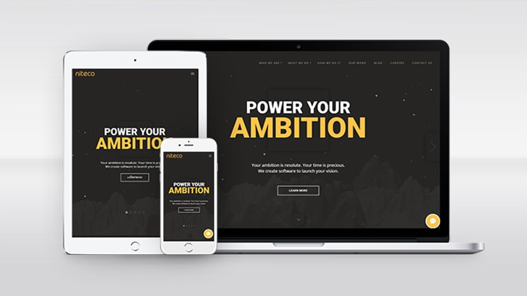 Responsive website design on laptop, tablet, and smartphone with ambition theme