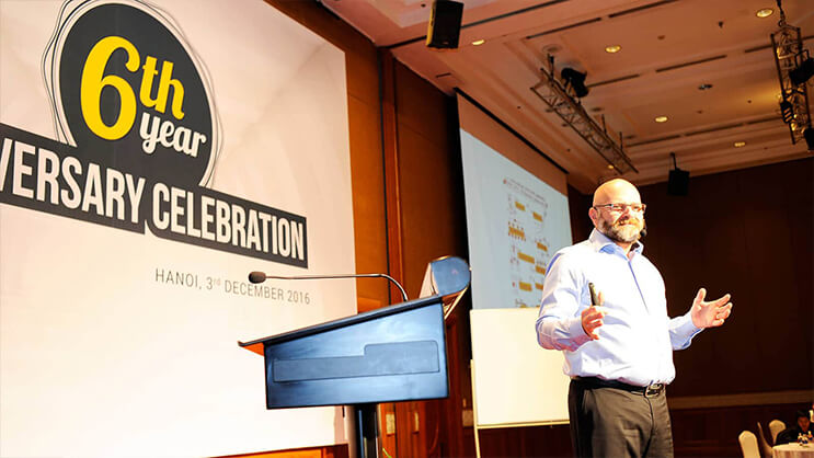6th year anniversary celebration speaker presenting in Hanoi conference hall