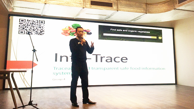 Man presenting Inte-Trace safe and transparent food information system on stage